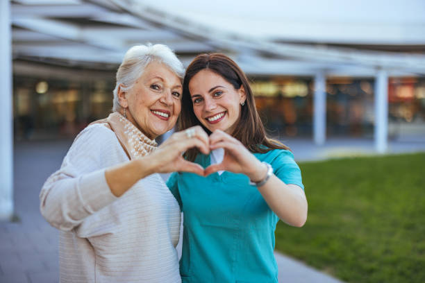 Resident and caregiver sharing a warm moment at Harmony House
