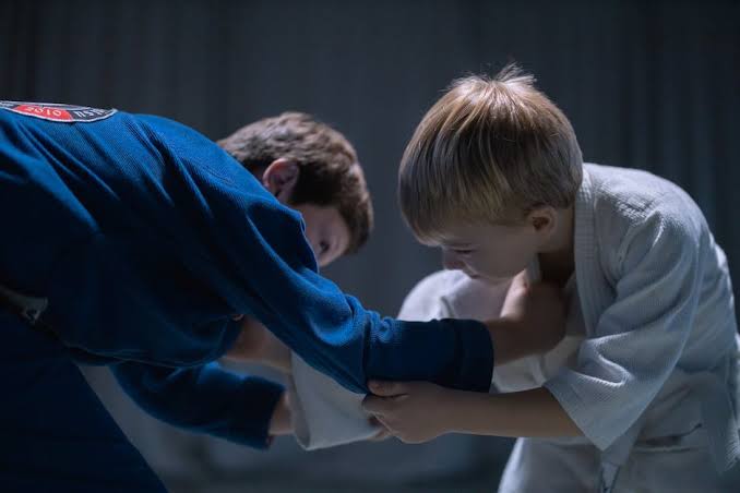 Kids grappling in gi